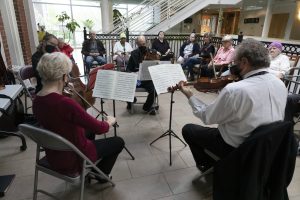 Landmarks Orchestra musicians perform a Music & Memory program for a group of older adults.